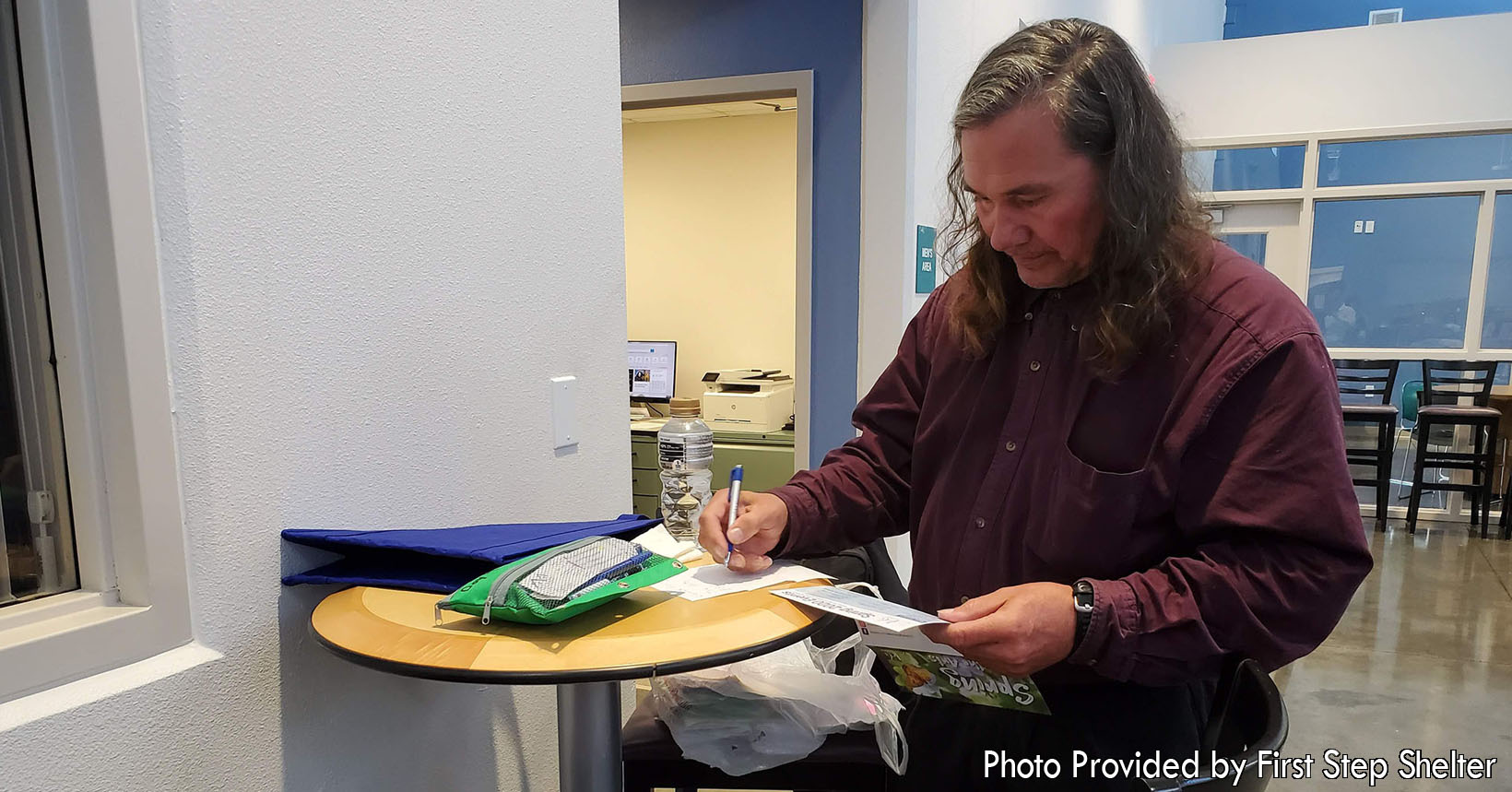 The residents of the First Step Shelter are all looking for opportunities to better themselves. Their main goal is to acquire a stable job and to become self-sufficient. This resident has just come back from a job fair and is writing down some notes that will be beneficial to him in the future.