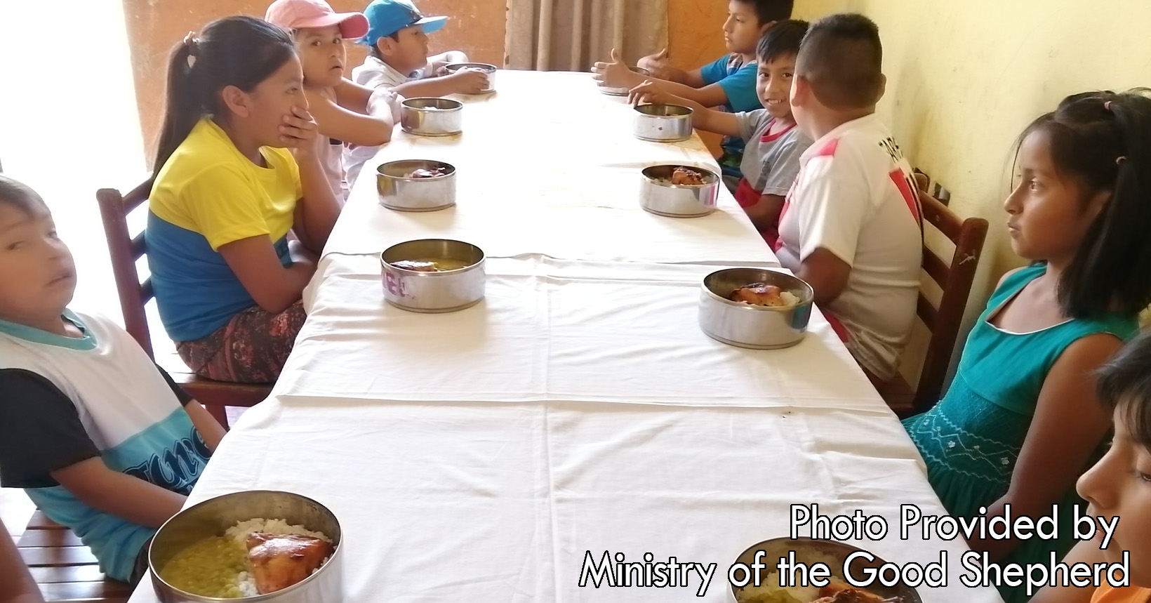 After doing their studies the children gather around to enjoy some food. In their bowl, the kids will be eating rice and chicken. The Ministry of The Good Shepard makes sure that the children's appetite is taken care of.