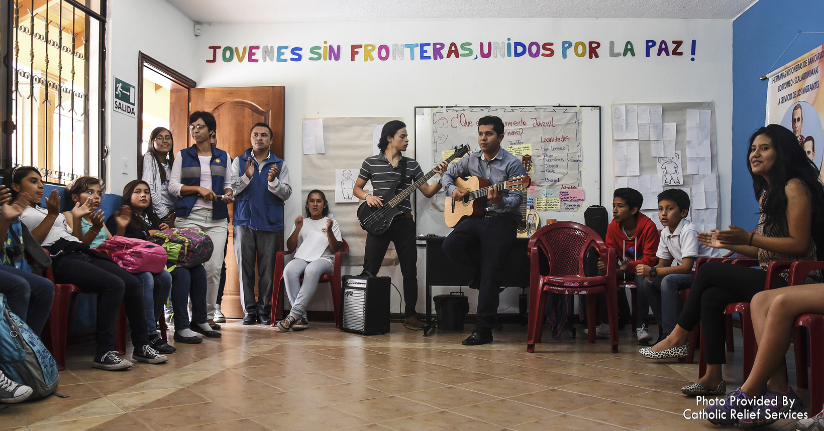 A group of migrants and refugees share life experiences and music.