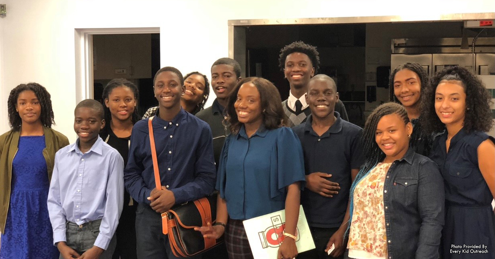 Lashea Reeves (centered) after teaching a financial literacy course to students of EKO's leadership program at Maitland Presbyterian Church.