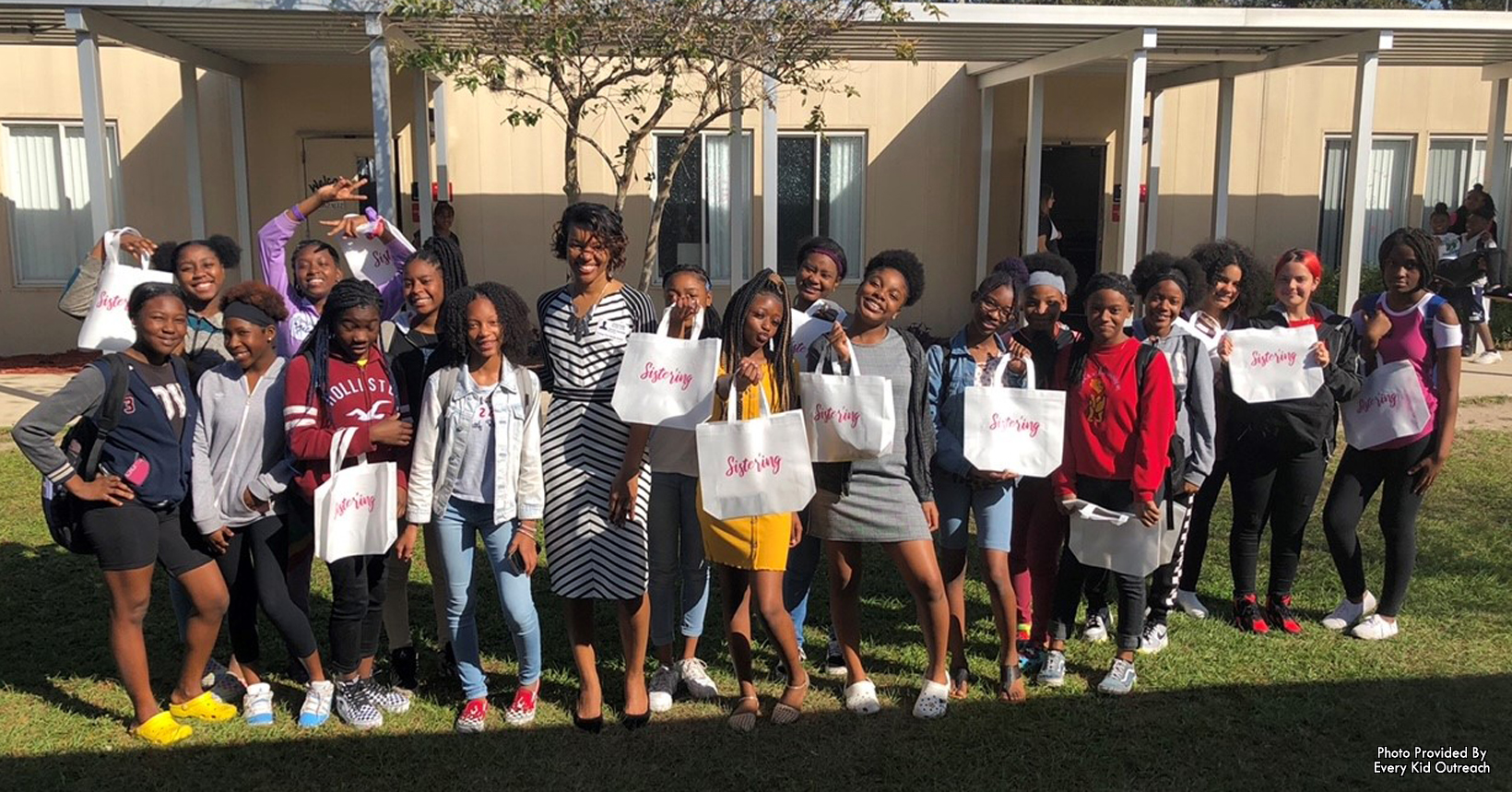 EKO's Executive Director Michelle Reynolds mentoring "her girls" from College Park Middle School. They all received "Sister'ing" bags to remember the value working together as a community.