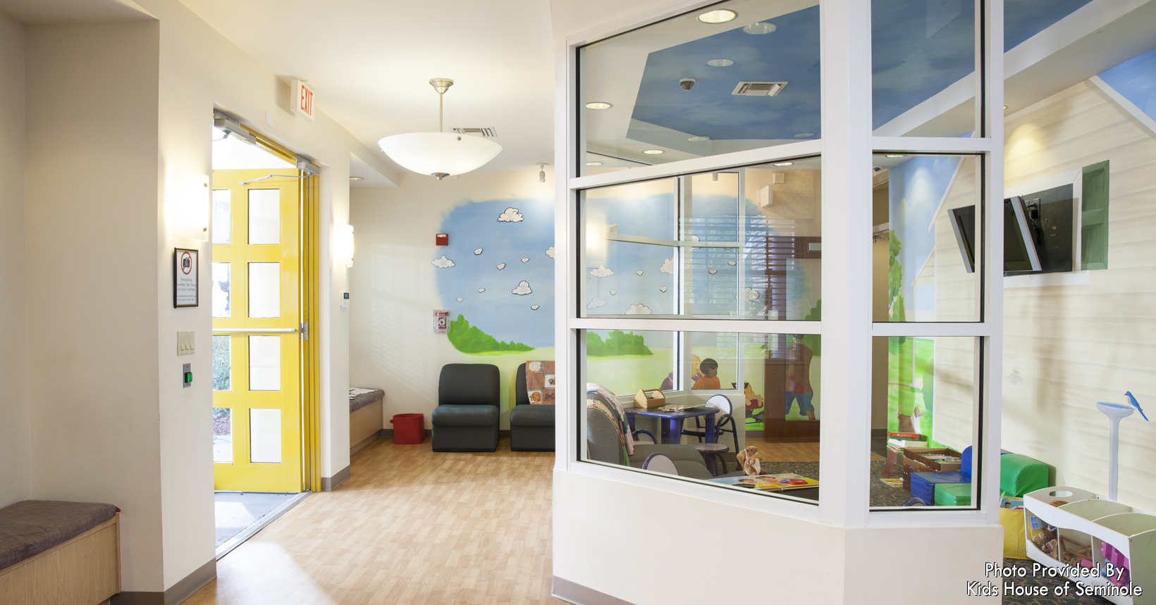 The front lobby to the Kids House. When children and families arrive to Kids House, the children are invited to read books, watch movies and have fun in the playroom. This allows the children to feel comfortable while they are visiting.