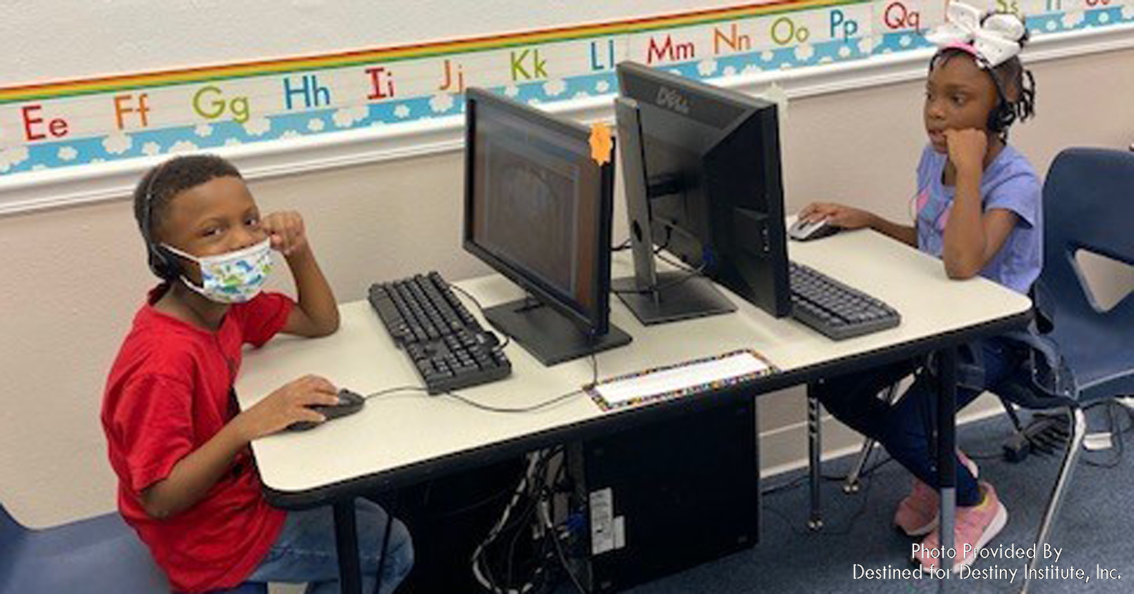 These two young students are having one of their computer sessions where they learn new things every day.