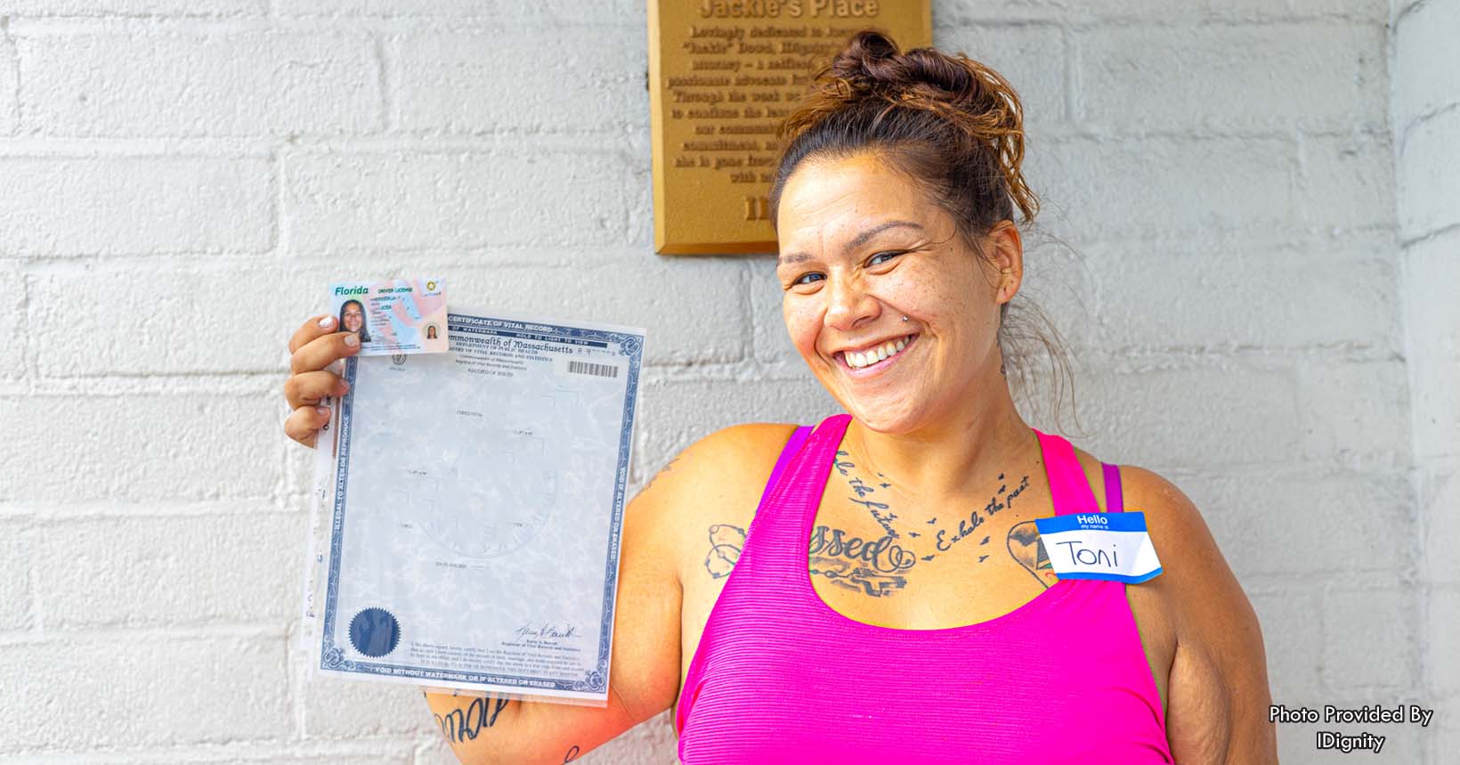 Client Toni smiles with her regained birth certificate she obtained with the help of IDignity. Toni fled an abusive relationship, and sadly, had no choice but to leave all of her documents behind. Toni can now begin working and start her brand new life.