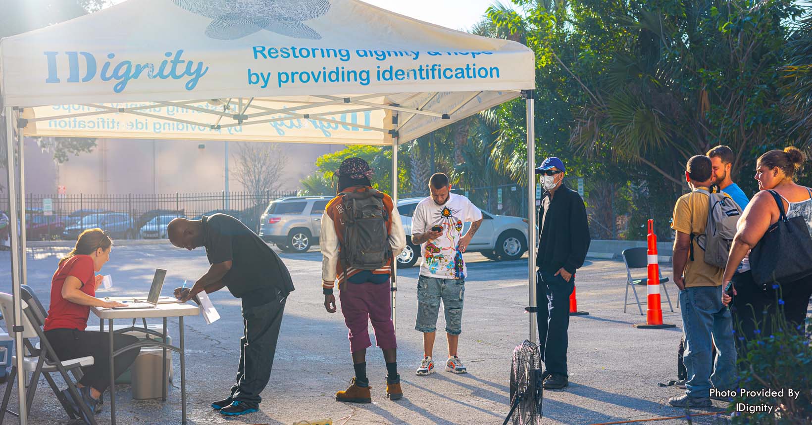 Clients from all walks of life wait their turn in check-in at IDignity’s Identification Service Days. Without their identification, these individuals are unable to participate in our modern society.