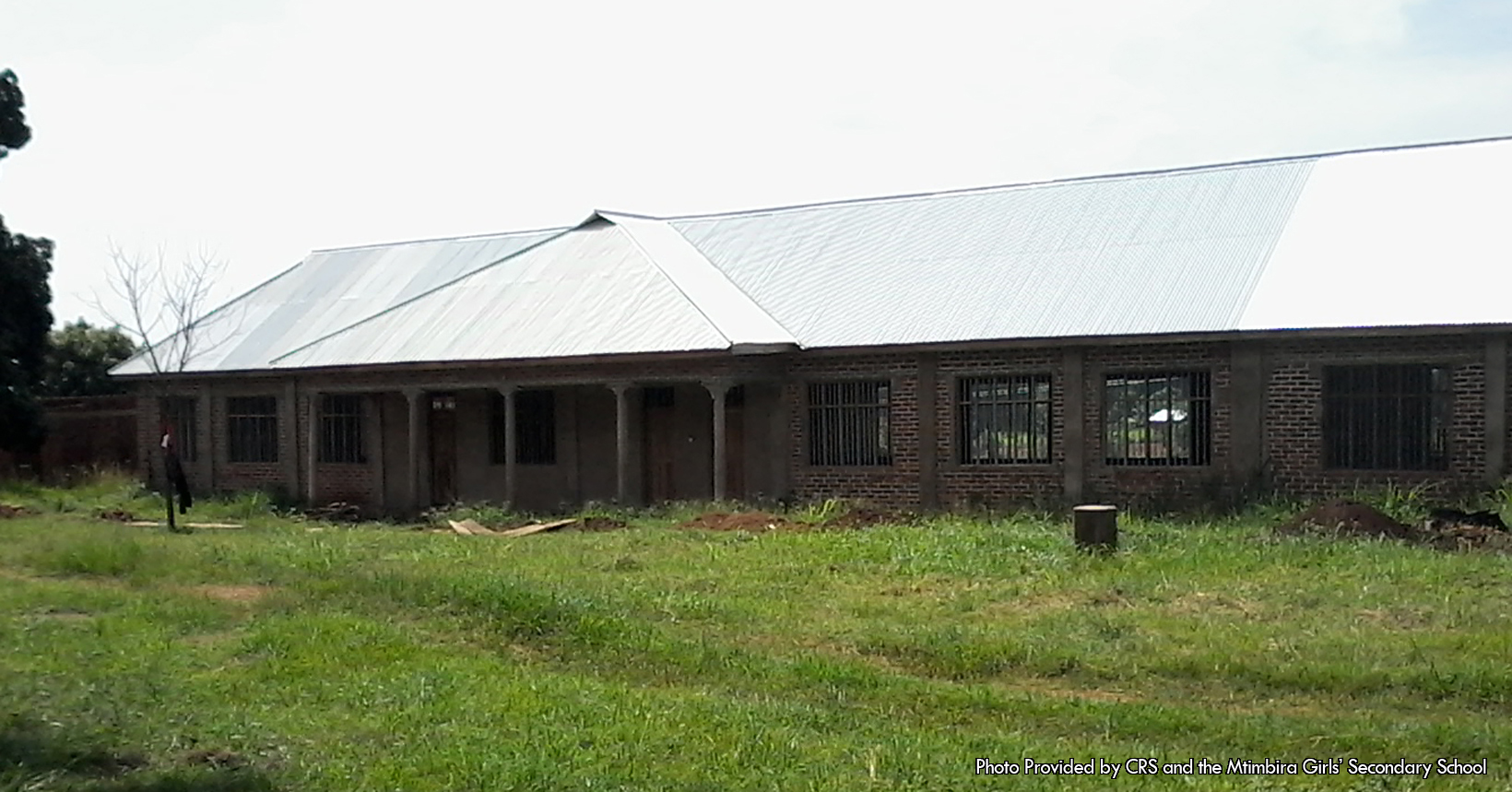 This picture was taken outside of Tanzania and was provided to us by the Catholic Relief Services. This building is part of the Mahenge School that houses the labs. The building is under construction since as of the time of the photo, the building has some structural damage. In addition, the grass plain in front of the building has dead grass and pieces of wood laying out in front of it. Furthermore, there are piles of dirt all along the front of the building. There is one patch of dirt on the right side of the picture and another located directly in front of the doors to the lab. The building also is made out of bricks and has five columns located in the front of the building. Not to mention, the top of the building is also white in color. The labs in this building are used for three subjects, biology, physics, and chemistry. These three subjects are very crucial in the education of the young girls in Tanzania. These three subjects are used in a lot of the areas of everyday life. For instance, chemistry is very important to teach these young girls since everything is made of chemicals. Knowing even the basics of chemistry can help you cook, mix chemicals, give plants proper nutrients, and last but not least how to effectively use drugs. As for physics, it is the basis of how the world we live in operates. Most of the technology that the students in the Mahenge School will use came from Physics in one way or another. All the electricity in the building came from exploration in physics. As for biology, it literally means the study of life. In the biology labs the girls will understand how plants grow, the functions of the human body, and even the functions of animal bodies.