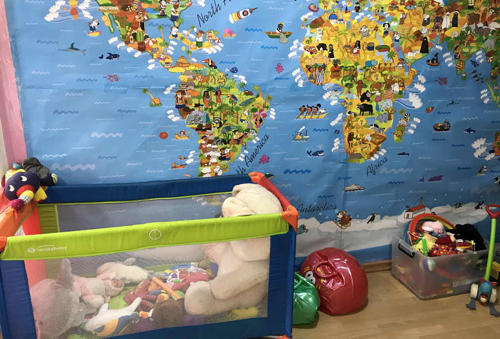 A child’s play room in the hub offers child care while parents receive educational and cultural support in the form of language classes, and job skills training.