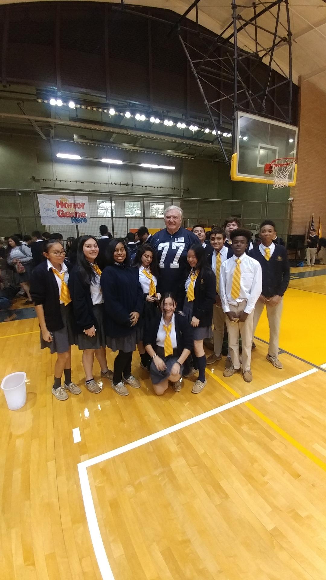 A group of young students gather around Mike McCoy after hearing his message. The young boys and girls were excited to learn from Mike everything he has learned. Their lives after this picture will be better going forward.