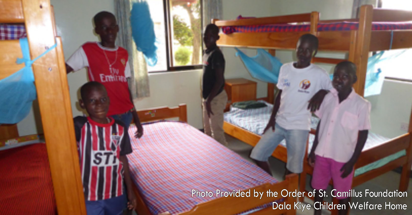 The young ladies here are a part of the project held by the Order of St. Camillus. Before beginning on any activities for the day, they must make sure that their beds are made. The young woman Lucy is almost finished tucking in her sheets to make her bed.
