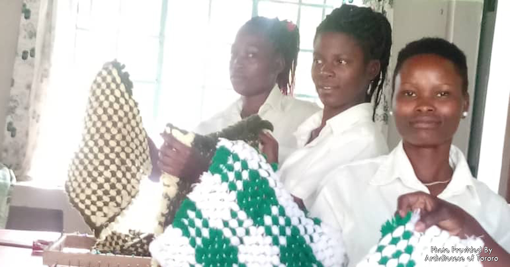 Students who are learning tailoring are showing off their woven tablecloths.