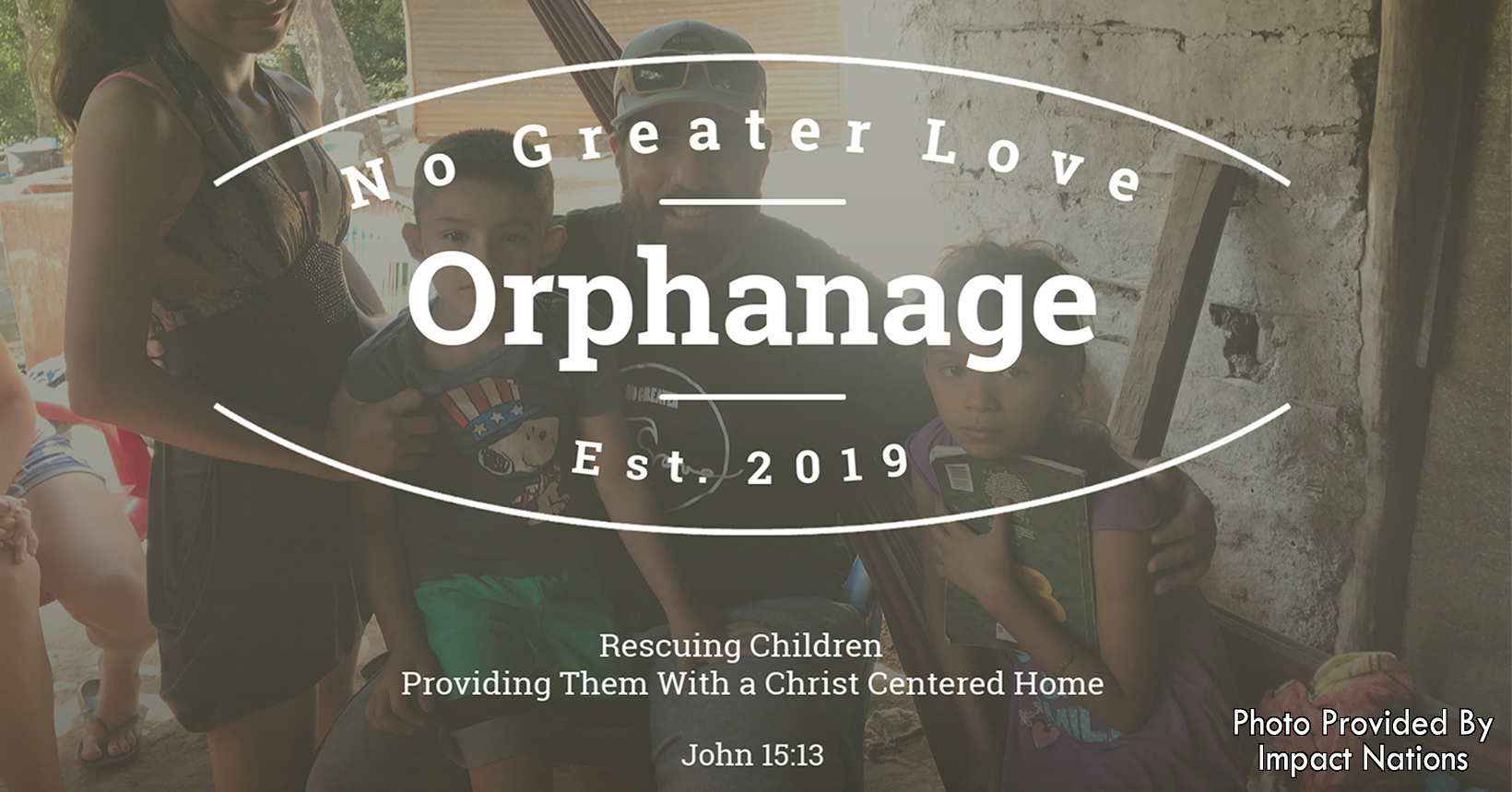 A reflection of children and the No Greater Love Orphanage Logo.