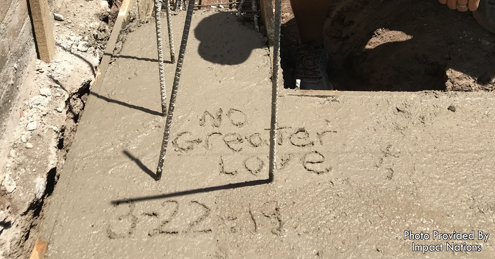The footer of the first home inscribed with No Greater love and the date 3-22-19.